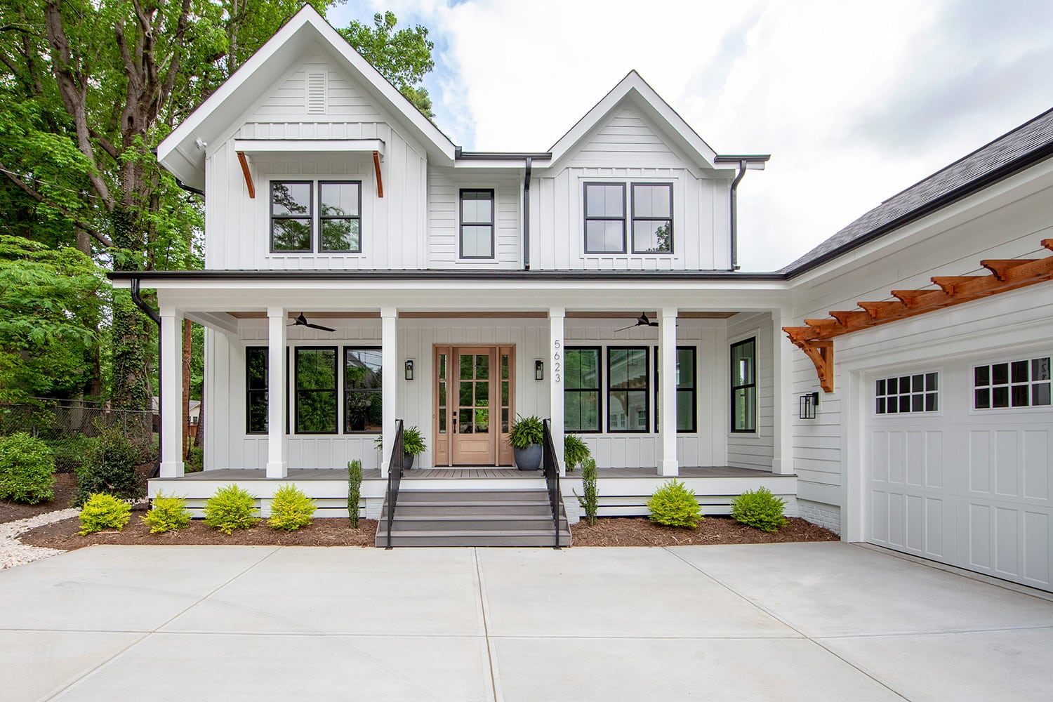 White, modern farmhouse custom home exterior in Charlotte, NC