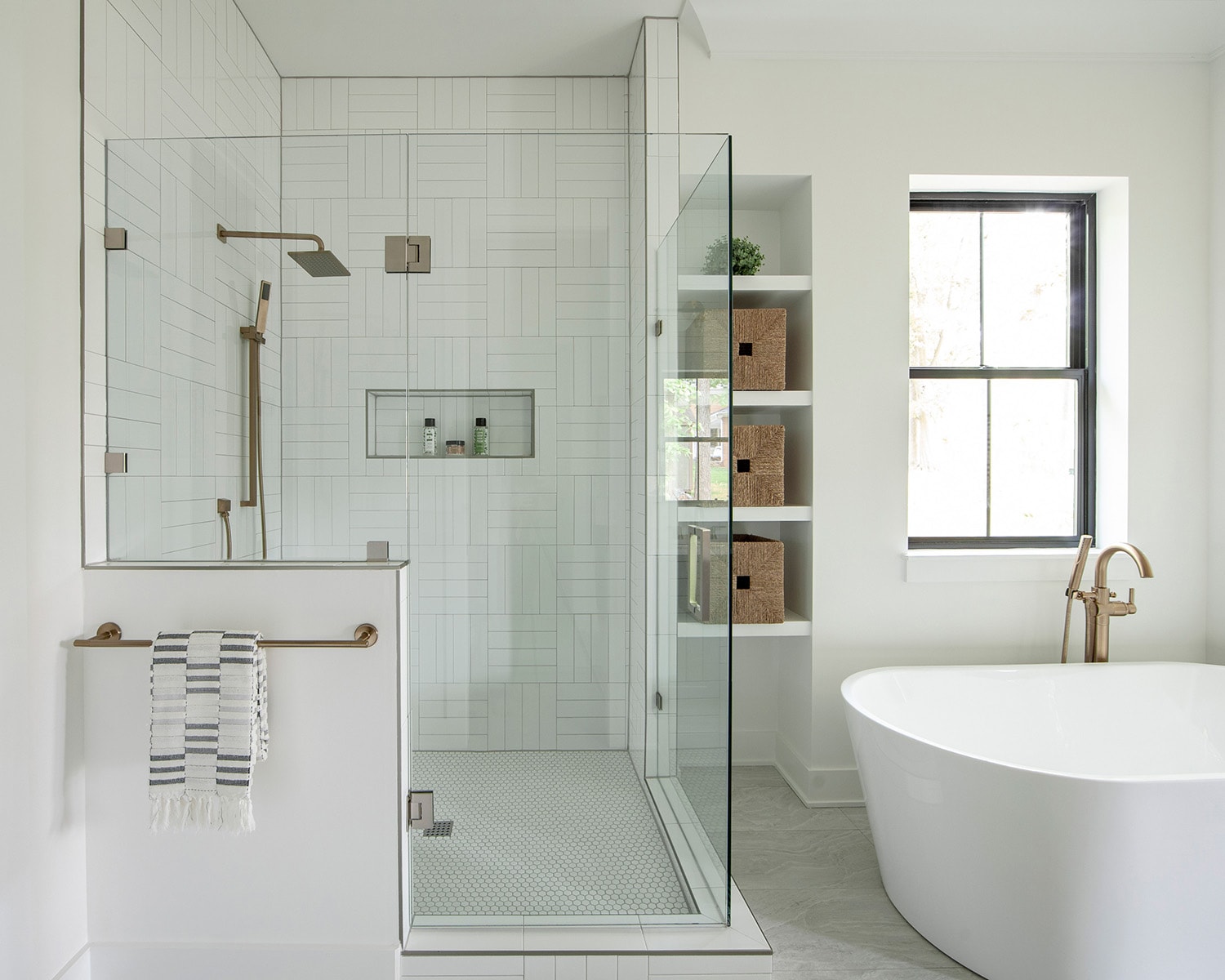 All white primary bathroom retreat with rain shower head and niche, custom home in Charlotte, NC