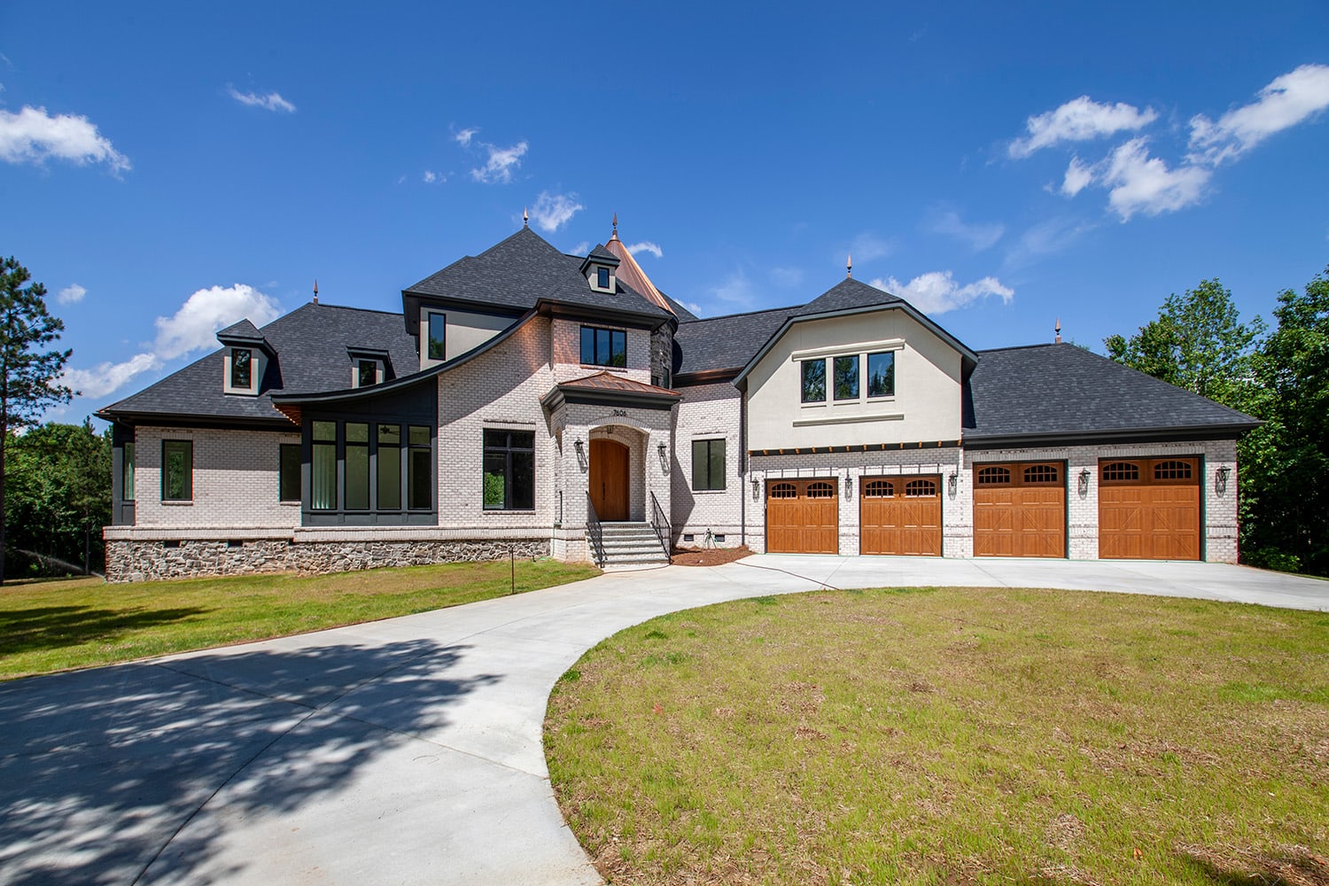 Custom home exterior in Charlotte, NC with four car garage